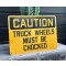 CAUTION -  Truck Wheels must be Chocked Schild