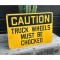 CAUTION -  Truck Wheels must be Chocked Schild